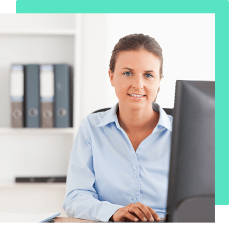 A woman conducting UX analysis at a desk in front of a computer for optimization purposes.